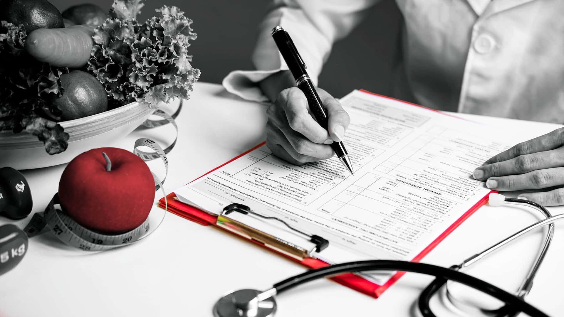 nutritionist writing on a medical document